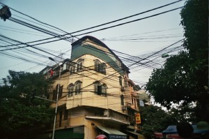 Spiderweb of power cables at an intersection...