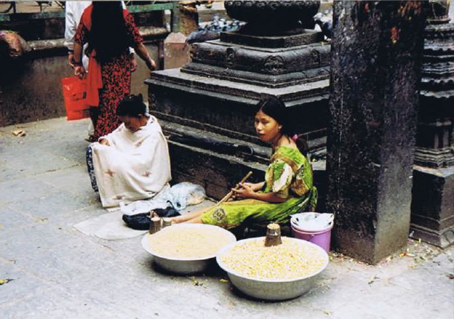 Lady selling yellow rice used at sacred rituals... 