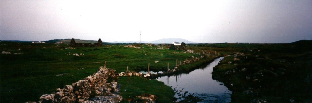 View from the coast in to the Connemara with its green meadows, white washed cottages, dry stone walls and far away mountains...