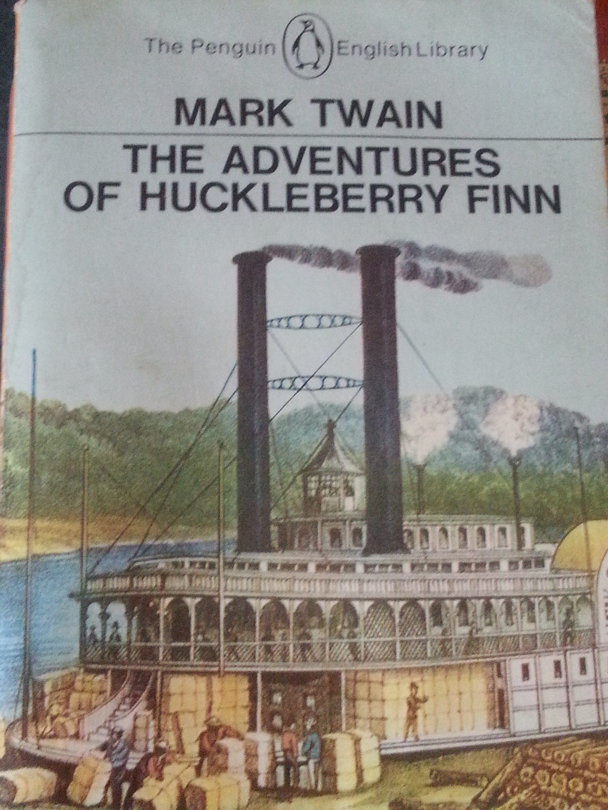 The Adventures of Huckleberry Finn by Mark Twain...