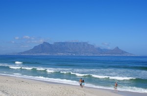 "Table Mountain DanieVDM" by Danie van der Merwe from Cape Town, South Africa - View of Table Mountain from Bloubergstrand. Licensed under CC BY 2.0 via Wikimedia Commons - https://commons.wikimedia.org/wiki/File:Table_Mountain_DanieVDM.jpg#/media/File:Table_Mountain_DanieVDM.jpg